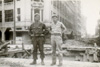 Lt Adams and friend in heavily damaged Baguio - click to enlarge